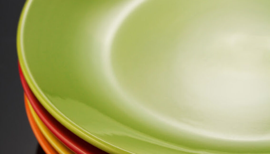 set of dishware on black background