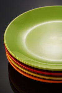 set of dishware on black background