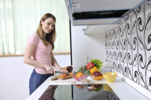 happy young  woman in kitchen