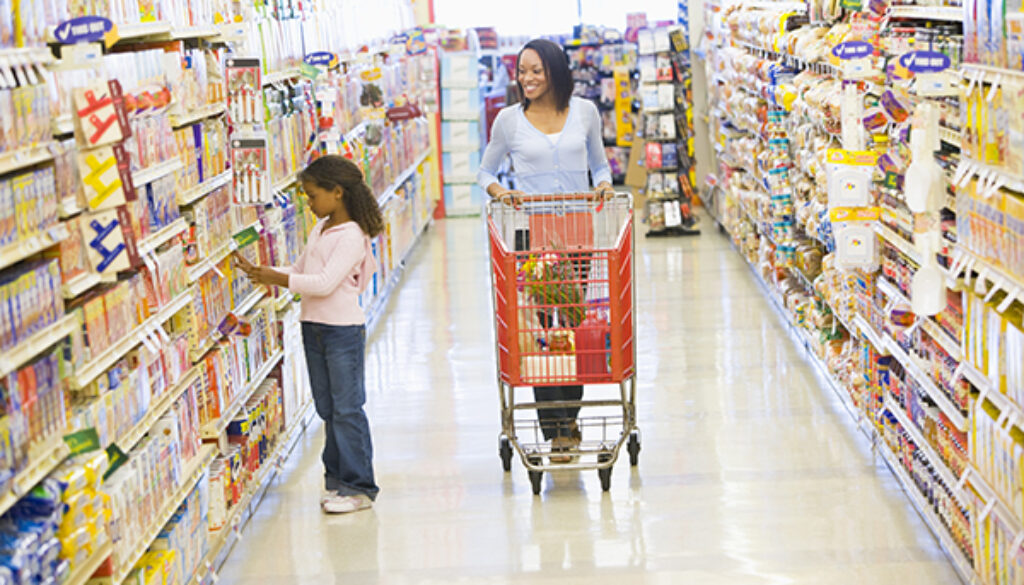 Mother and daughter shopping in supermarket