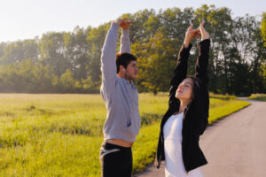 Couple doing stretching exercise  after jogging
