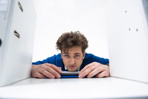 Bored businessman sitting at the table in office