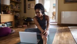 woman-with-laptop-yoga-mat