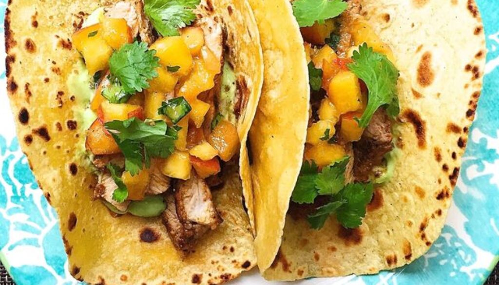 spiced-pork-tacos-avocado-crema-peach-salsa