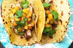 spiced-pork-tacos-avocado-crema-peach-salsa